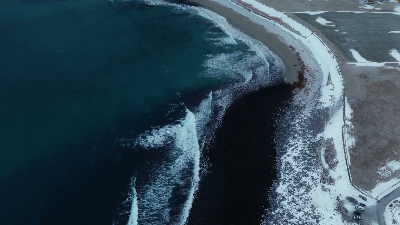 Arctic Waves Crashing on Snowy Coast