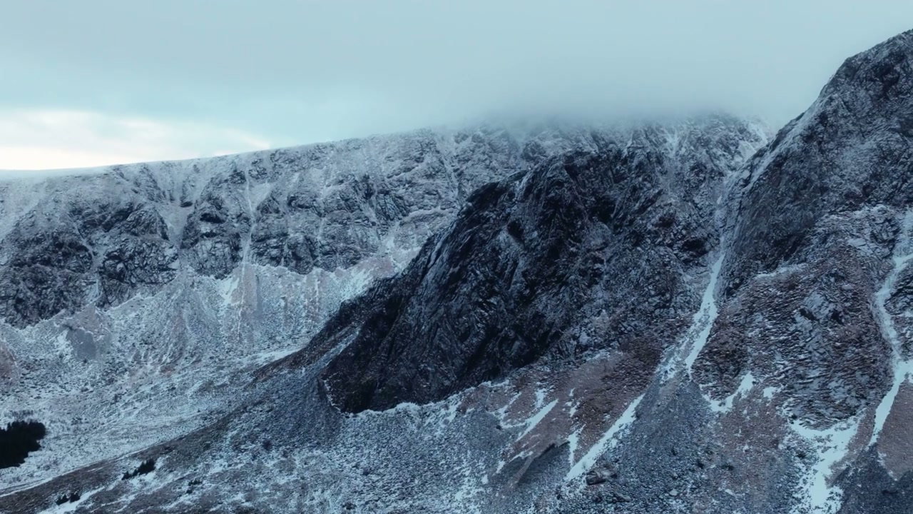 Icy Mountain Peaks Covered in Clouds, Norway