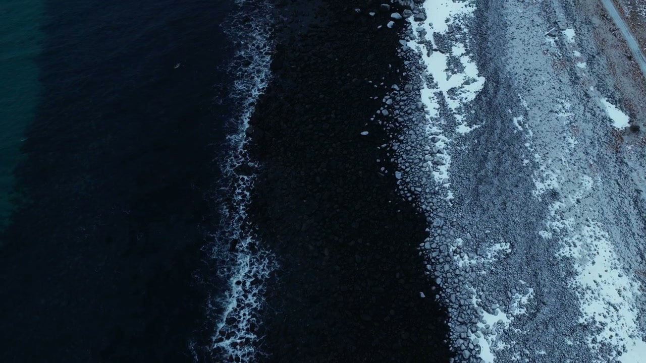 Ocean Waves On Snowy Rocky Coast