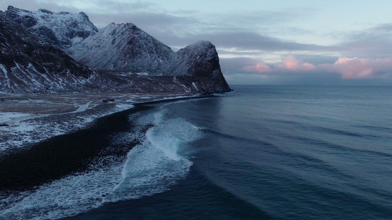 Arctic Ocean Waves on Snowy Norway Coast