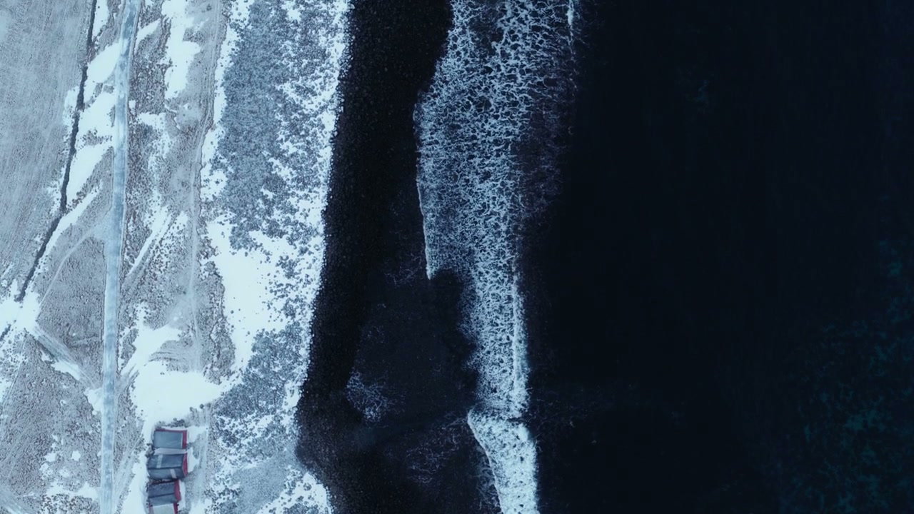 Waves Crashing on Snowy Norwegian Shore