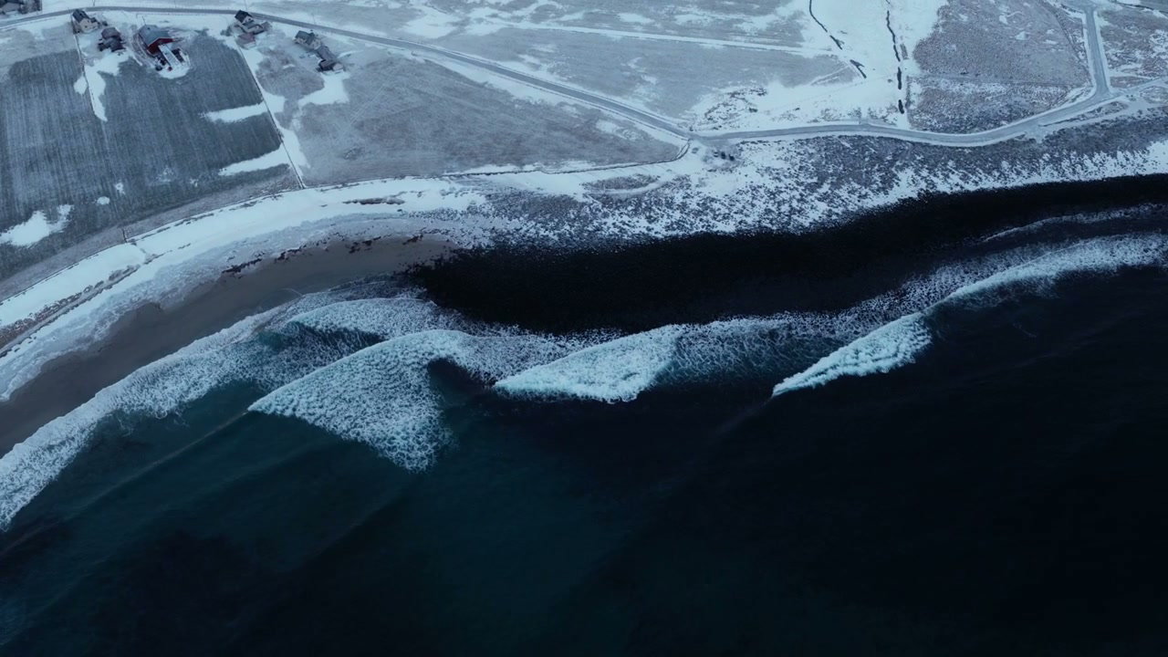 Arctic Ocean Waves on Snowy Coast