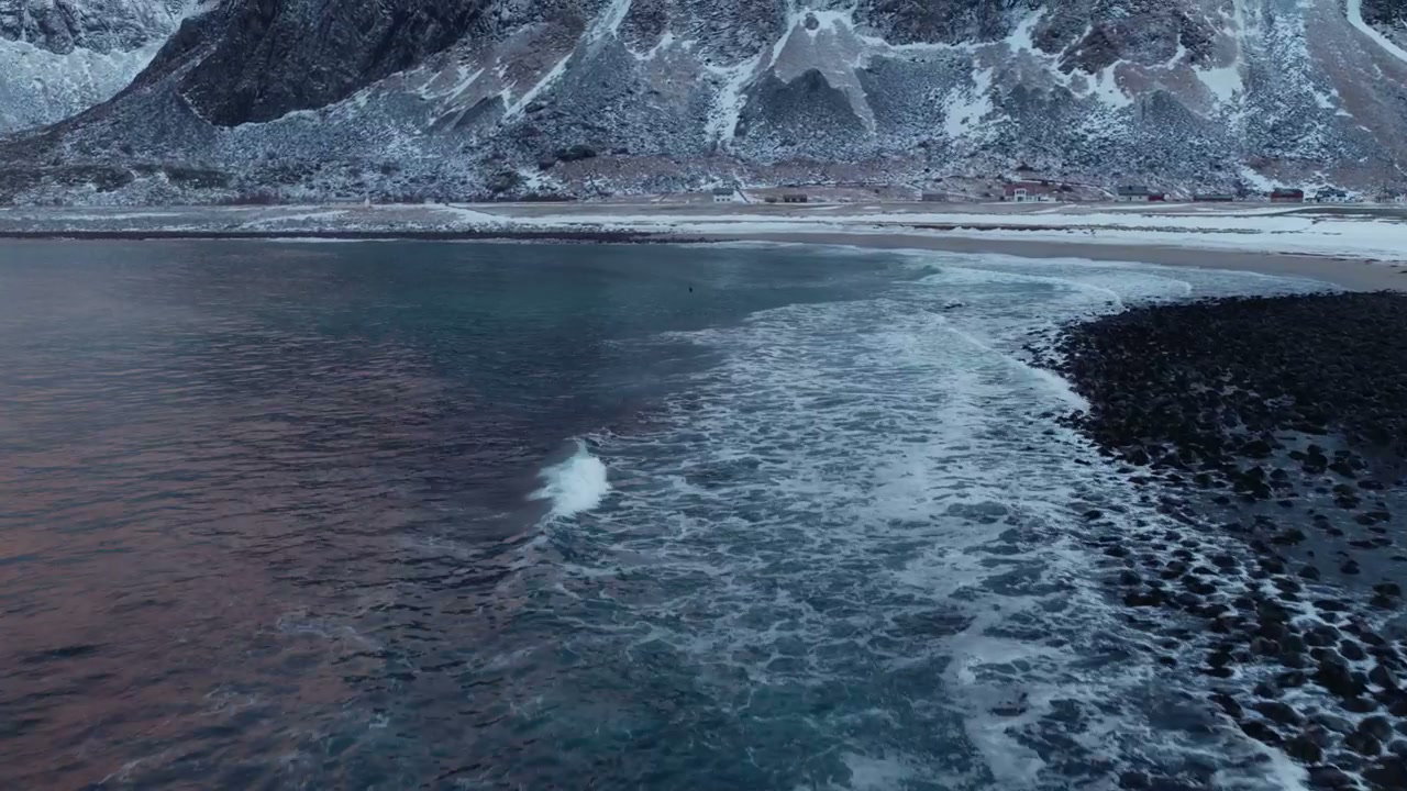 Arctic Ocean Waves and Snowy Mountains in Norway