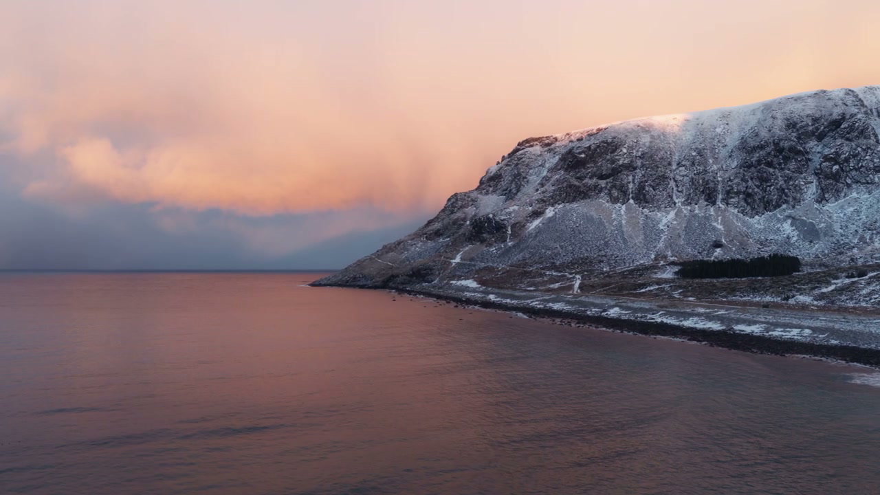 Snowy Arctic Coastline at Sunset
