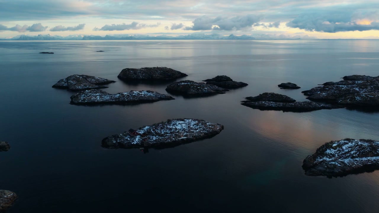 Aerial View of Snow-Dusted Arctic Islands at Dusk