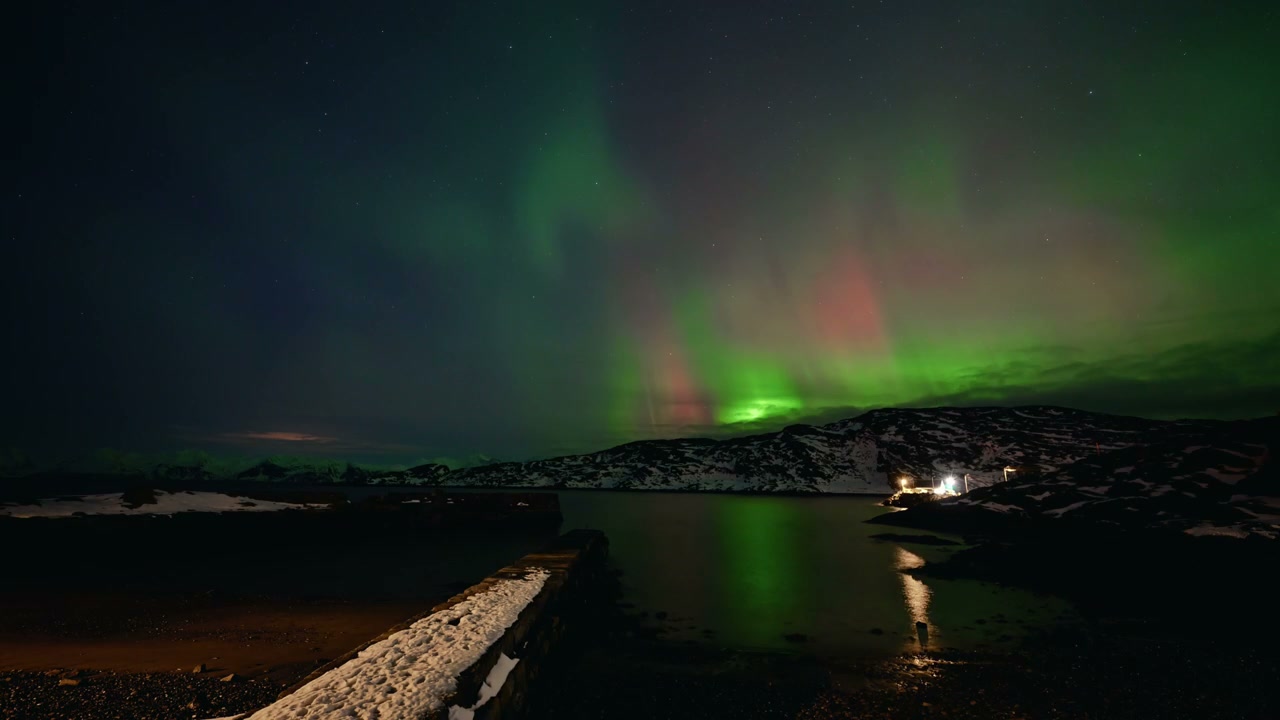 Aurora Borealis Over Snowy Norwegian Fjord