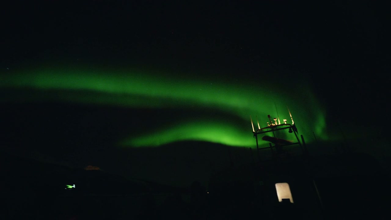 Northern Lights Dance in Dark Arctic Sky