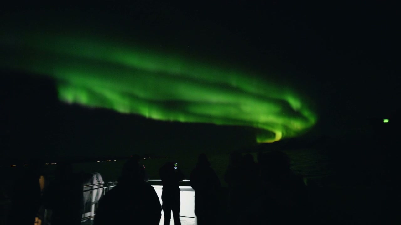 People Watching Northern Lights in Arctic Norway