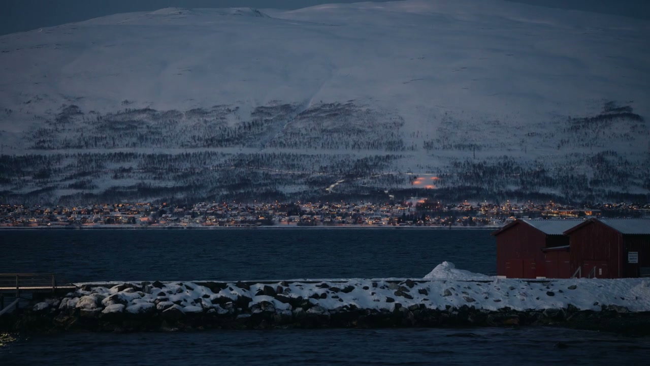 Winter Night Over Coastal Town in Arctic Norway