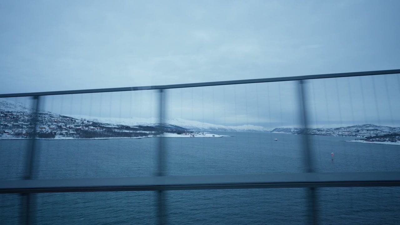 Snowy Fjord Landscape from Moving Vehicle