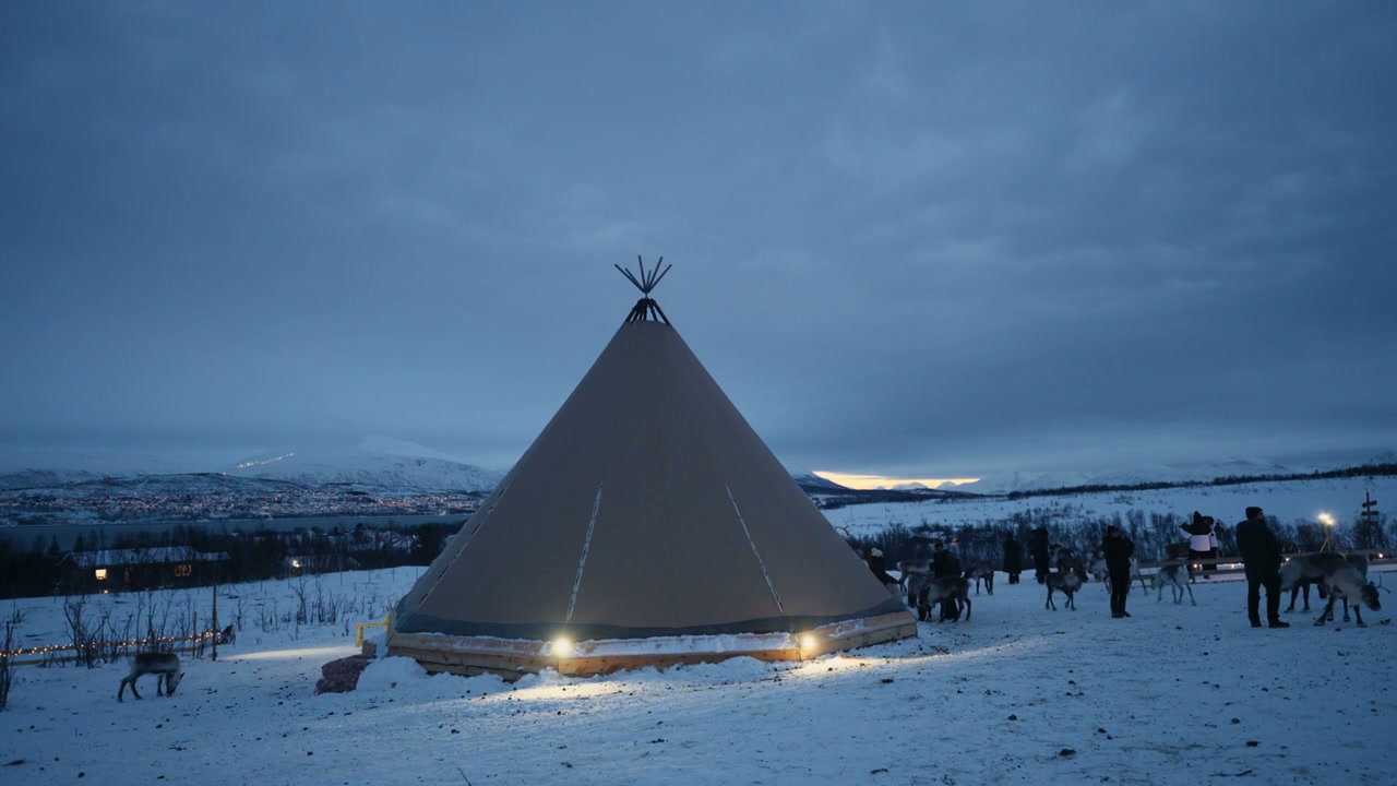 Reindeer and Lavvu Tent in Arctic Winter Landscape