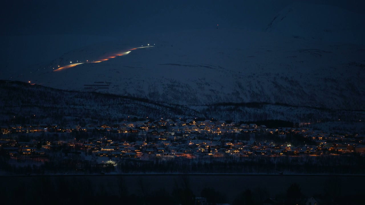 Arctic Town Lights at Night in Snowy Landscape