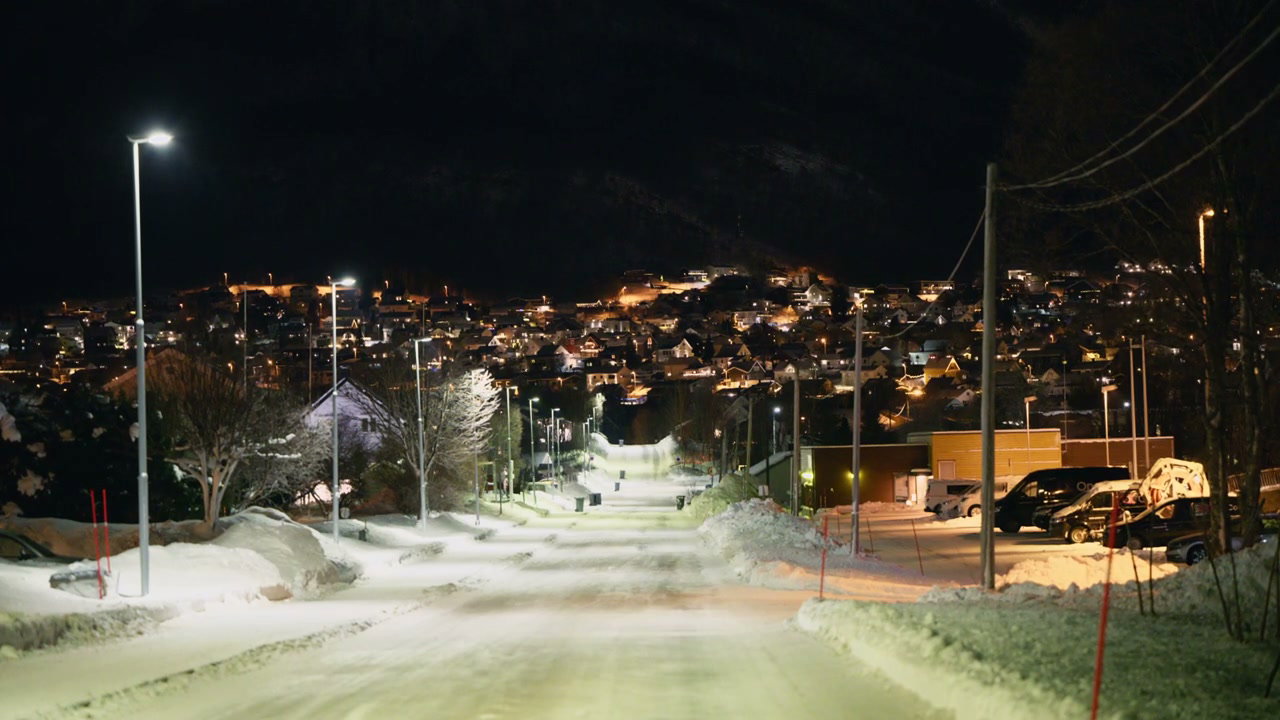 Snowy Town Street at Night in Norway