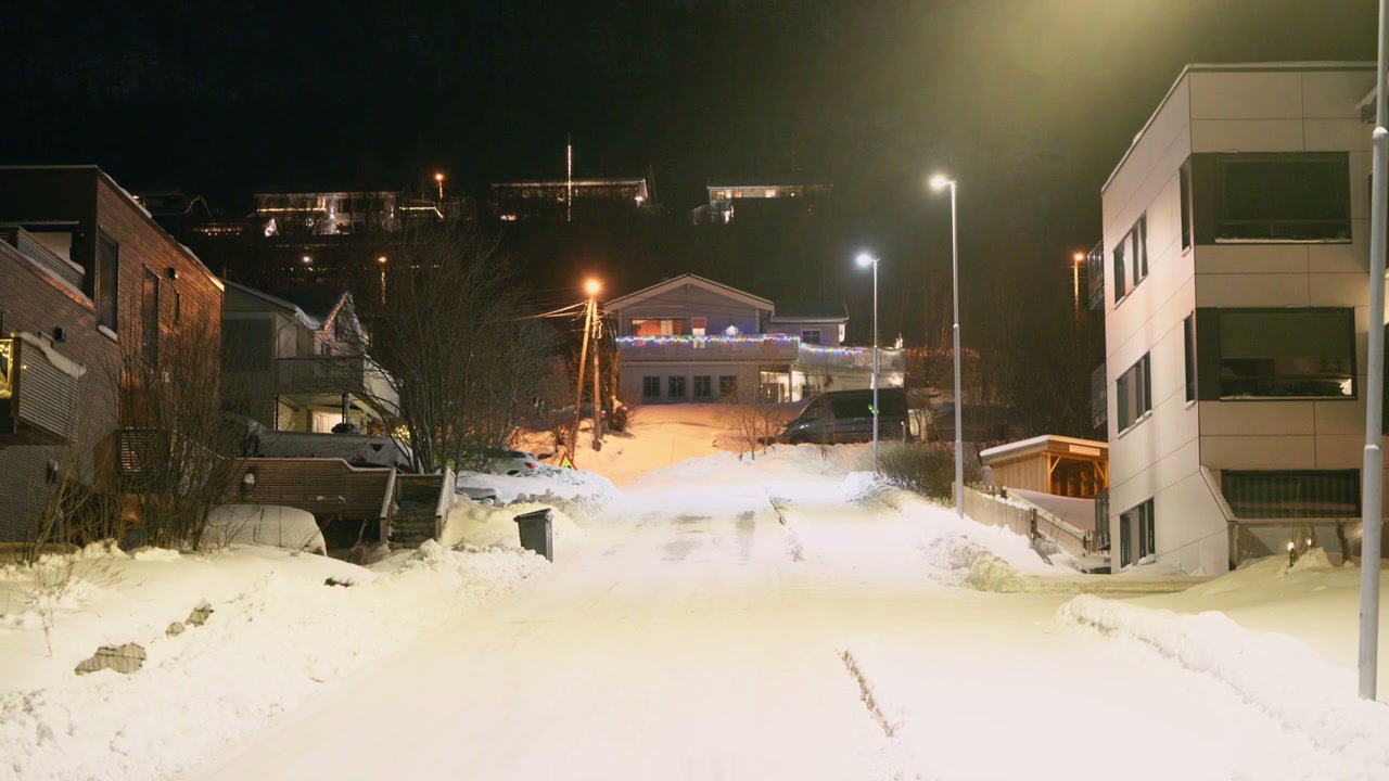 Snowy Residential Street at Night in Norway