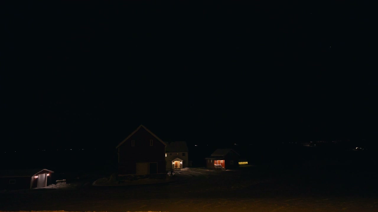 Arctic Winter Night with Illuminated Houses