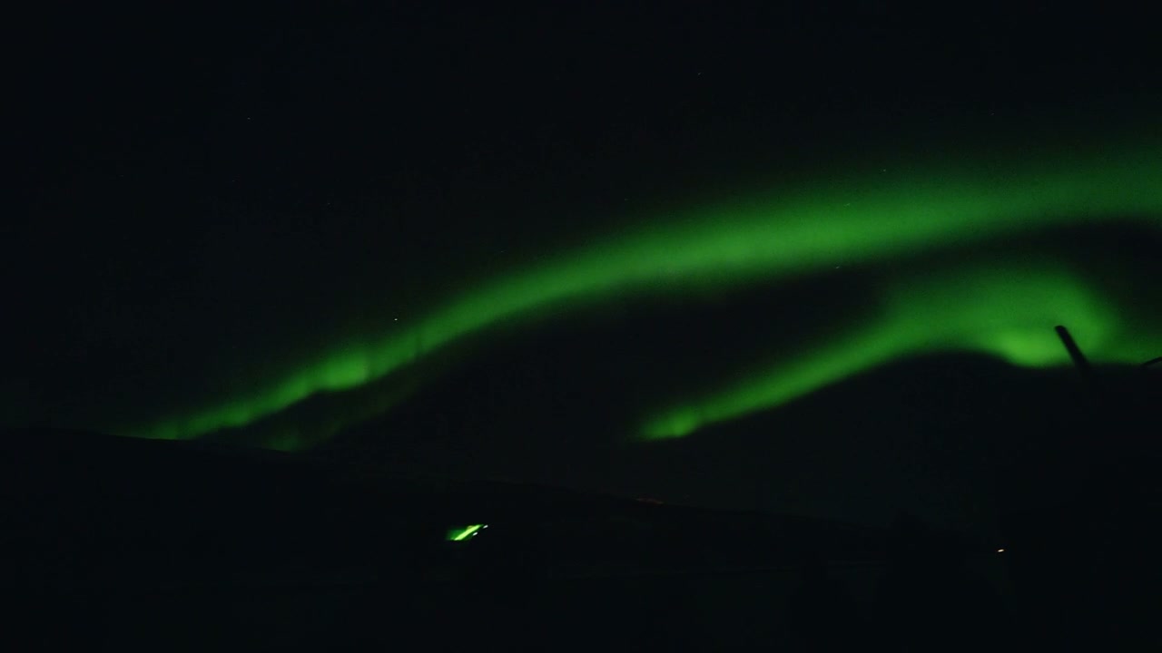 Vibrant Aurora Borealis Over Arctic Landscape