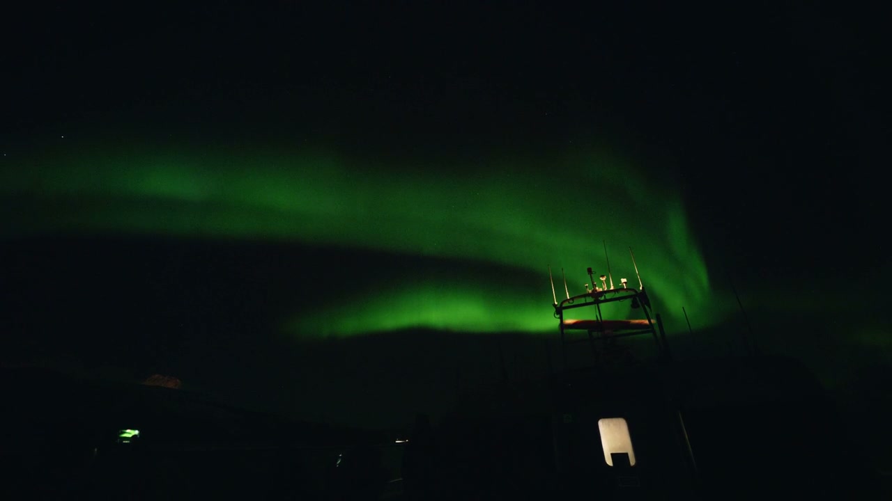 Aurora Borealis Over Arctic Landscape