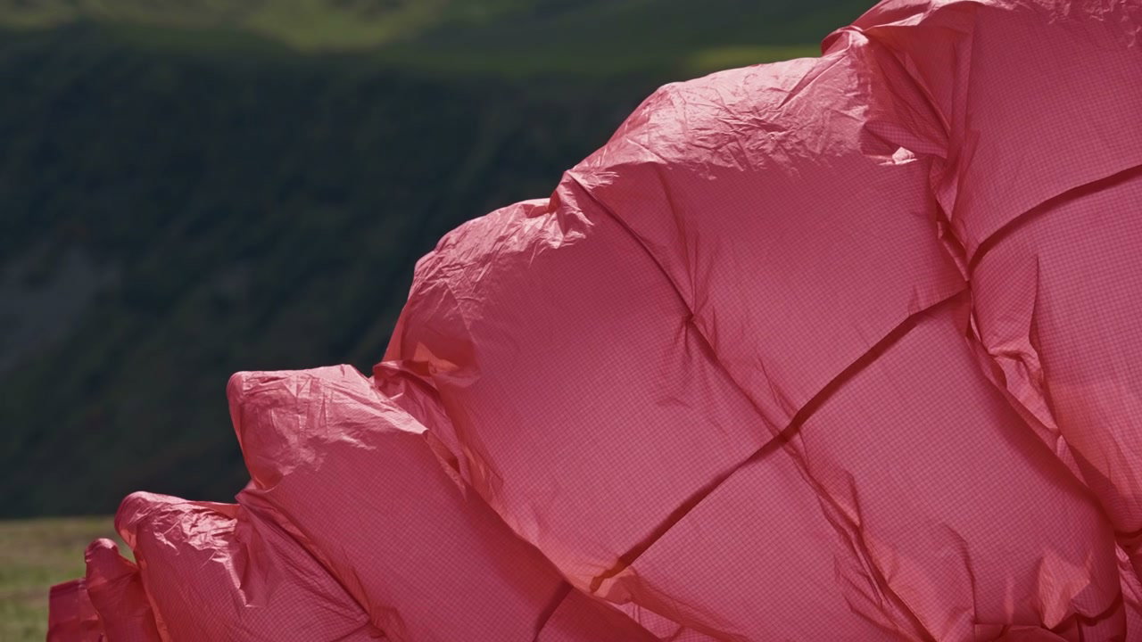 Pink Paraglider Wing Rippling in Wind