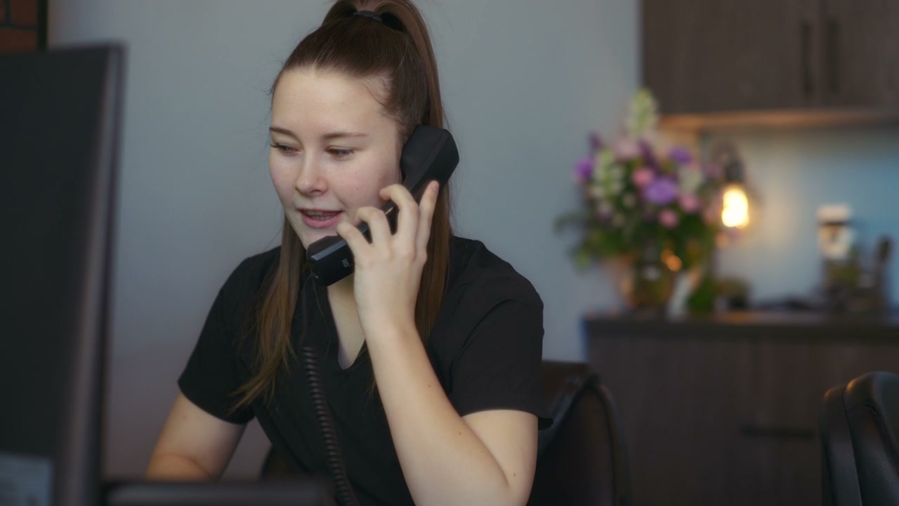 Receptionist Answering Phone Call