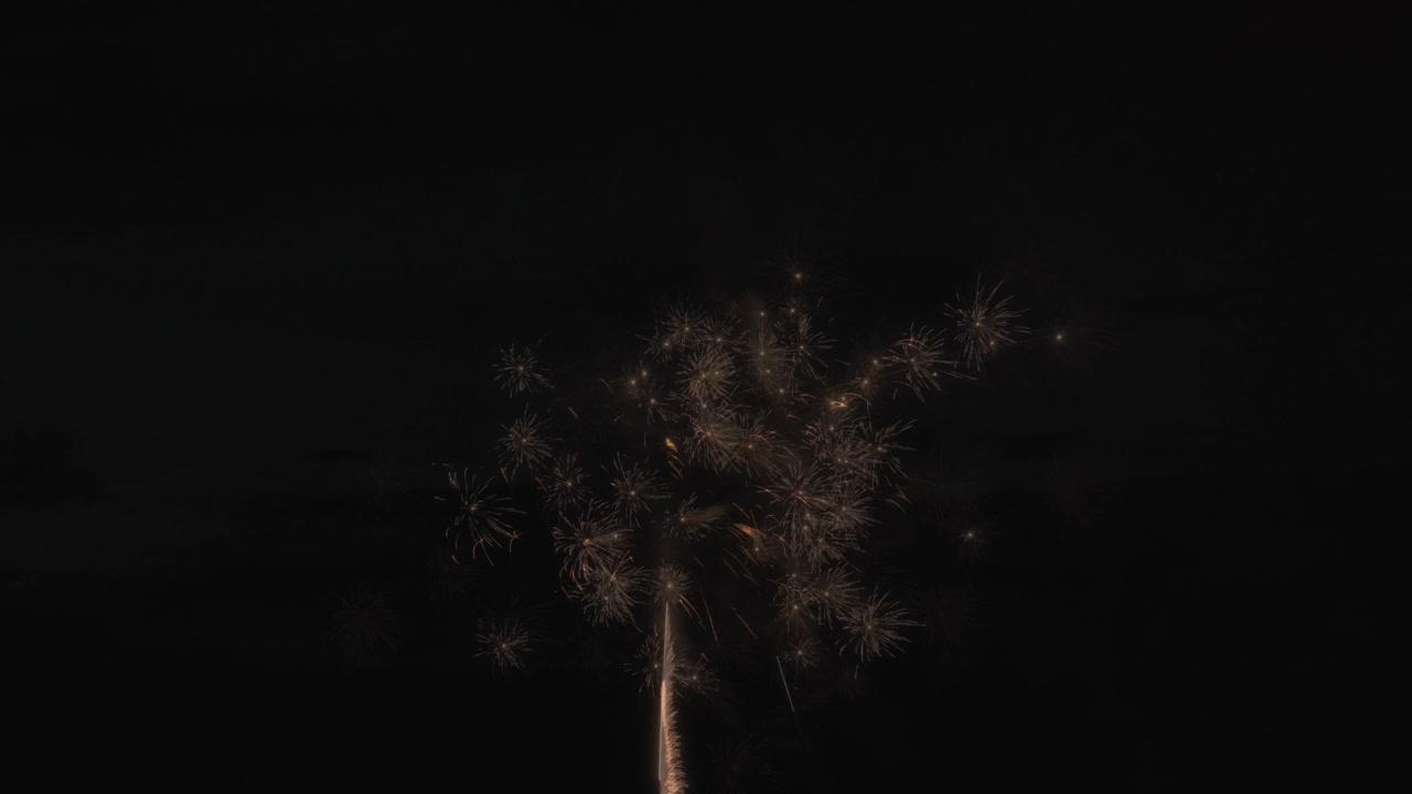 Vivid Fireworks Exploding Over Water at Night • Stock Video on Uppbeat
