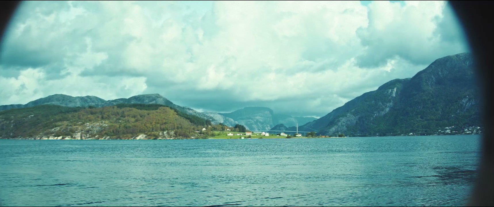 Scenic Fjord View Through Porthole