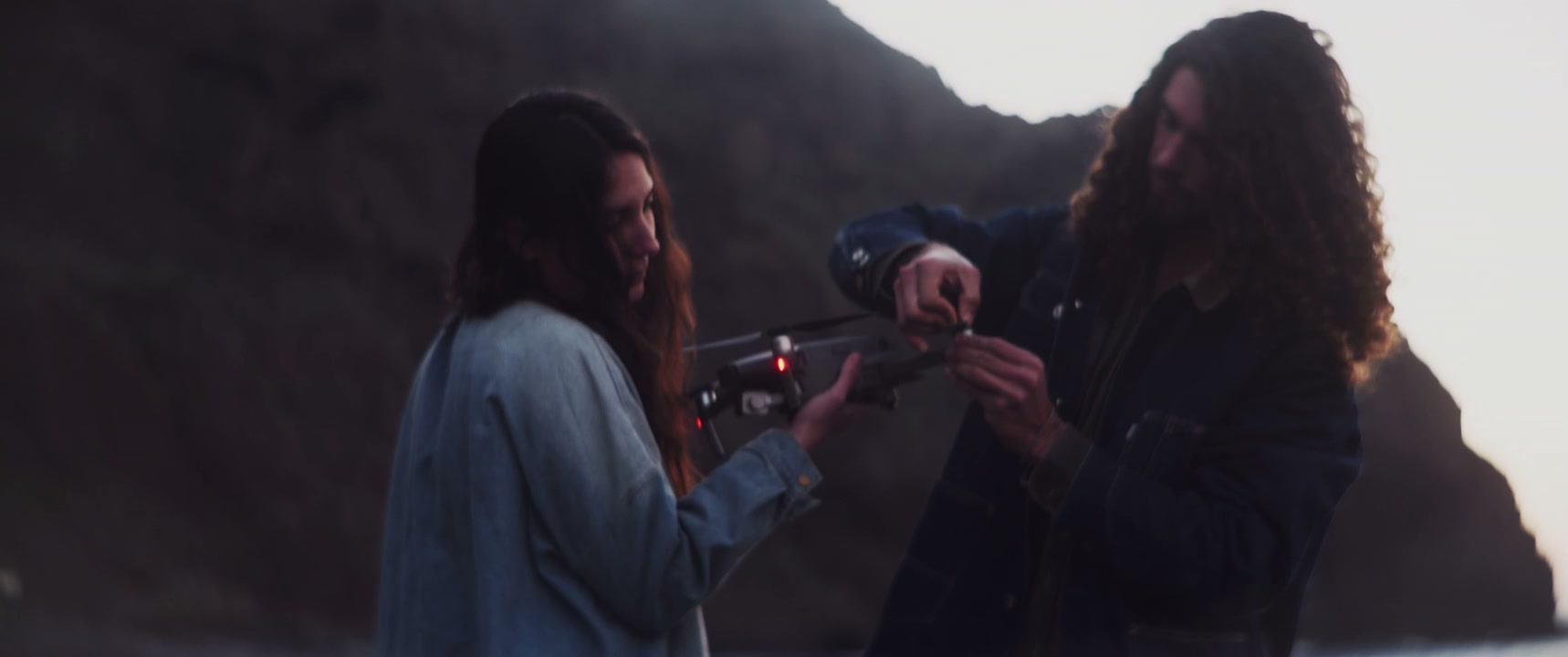 Man and Woman Prepare Drone