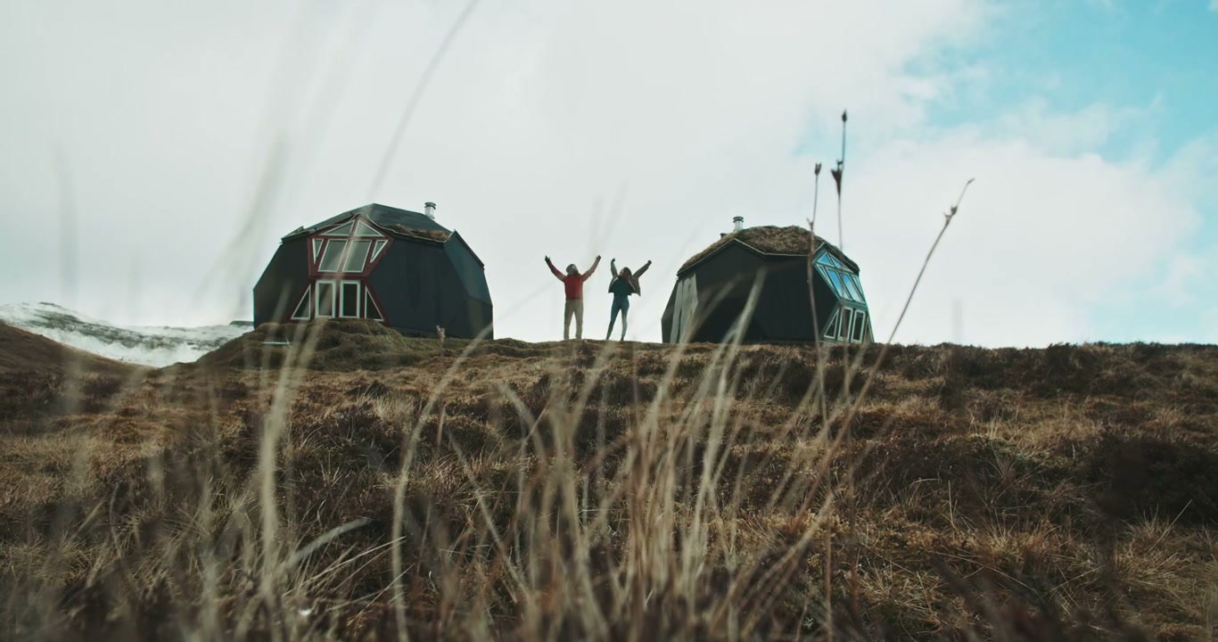 Couple Celebrating by Geodesic Domes