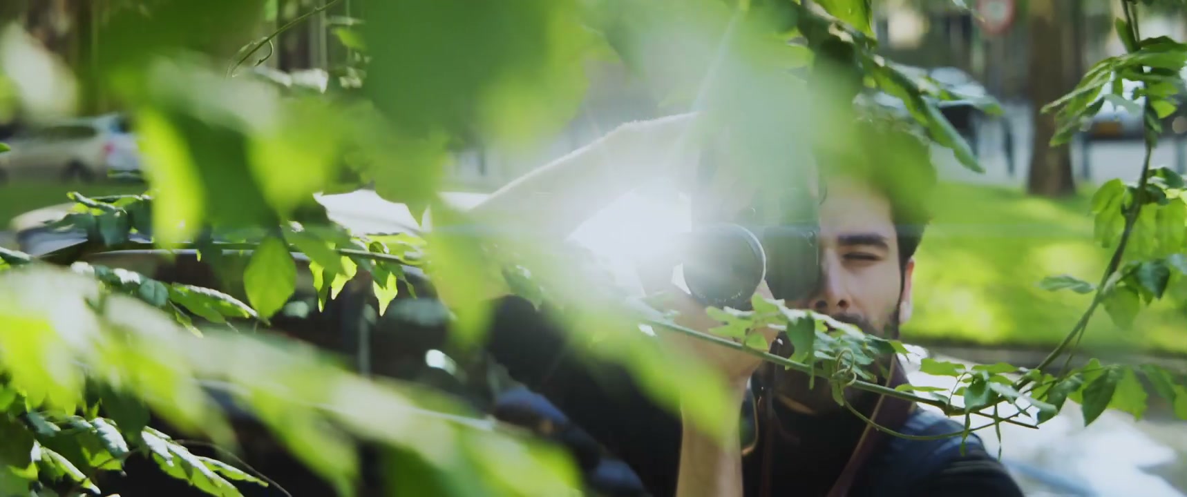 Street Photographer Through Leaves