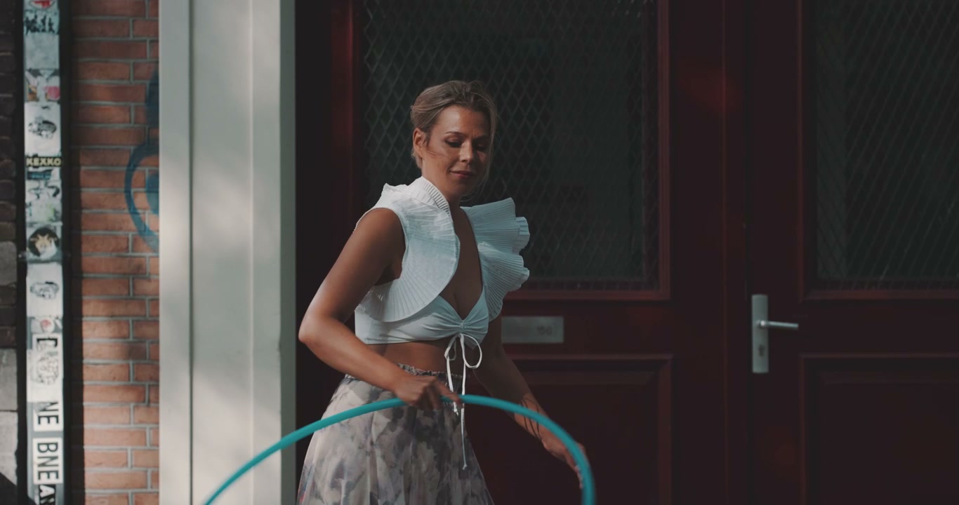 Woman Performing Hula Hoop Tricks