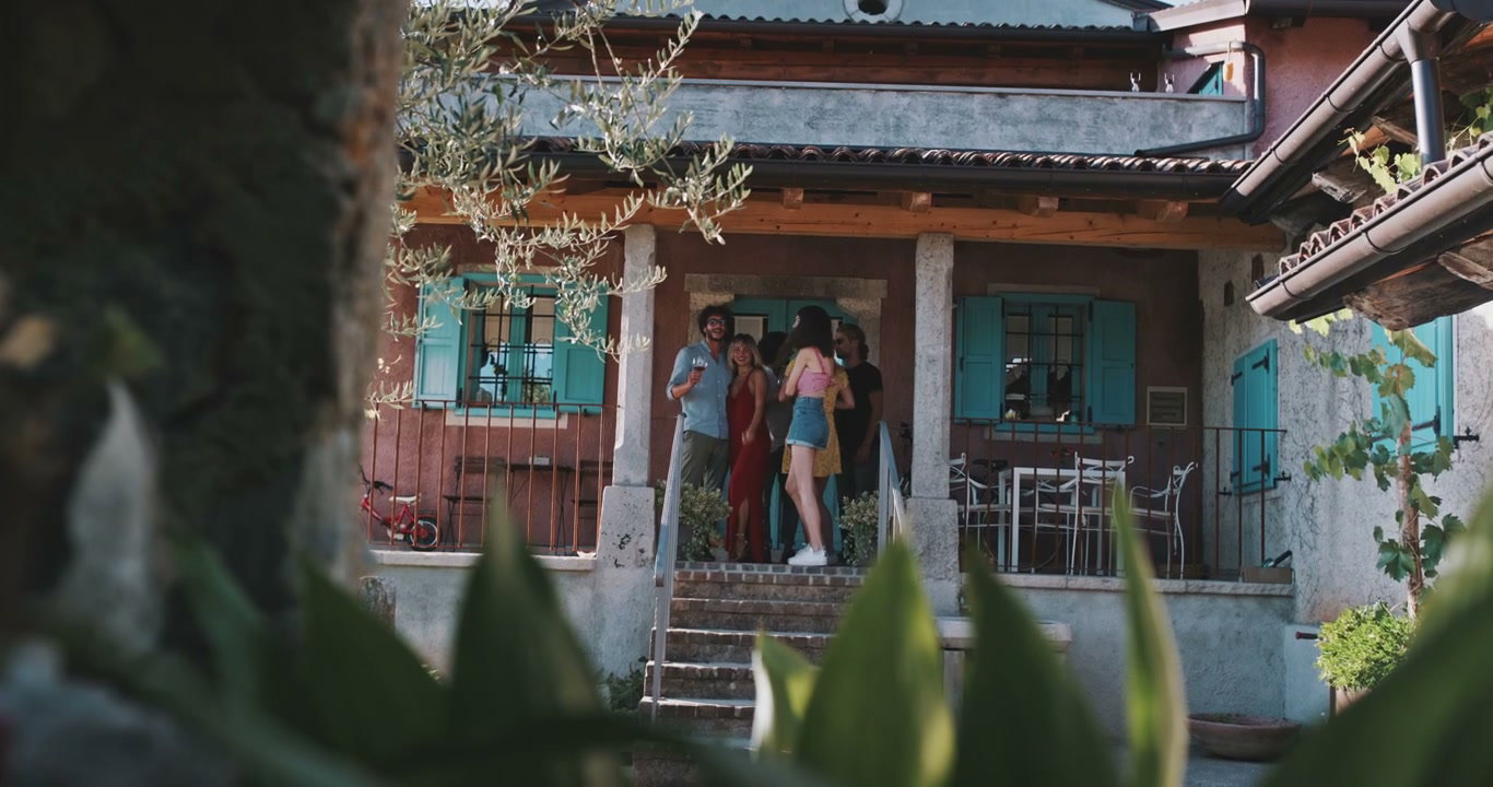 Friends Socializing on Villa Porch