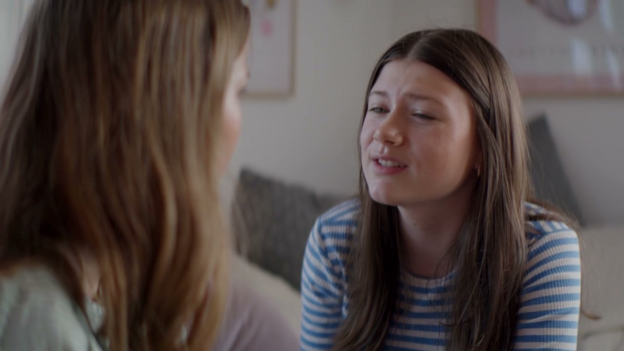 Young Woman Comforts Her Tearful Friend