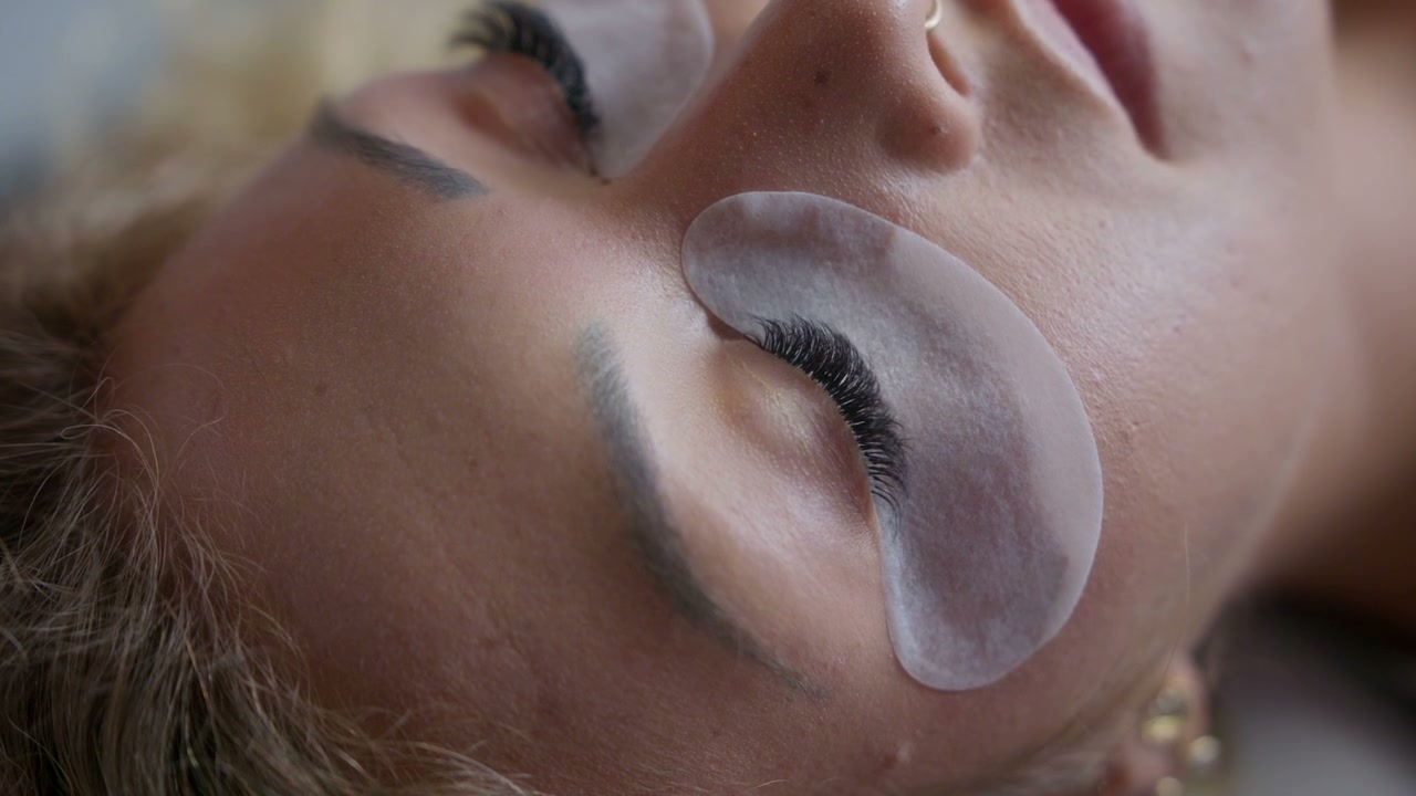 Beautician Adjusting An Eye Mask