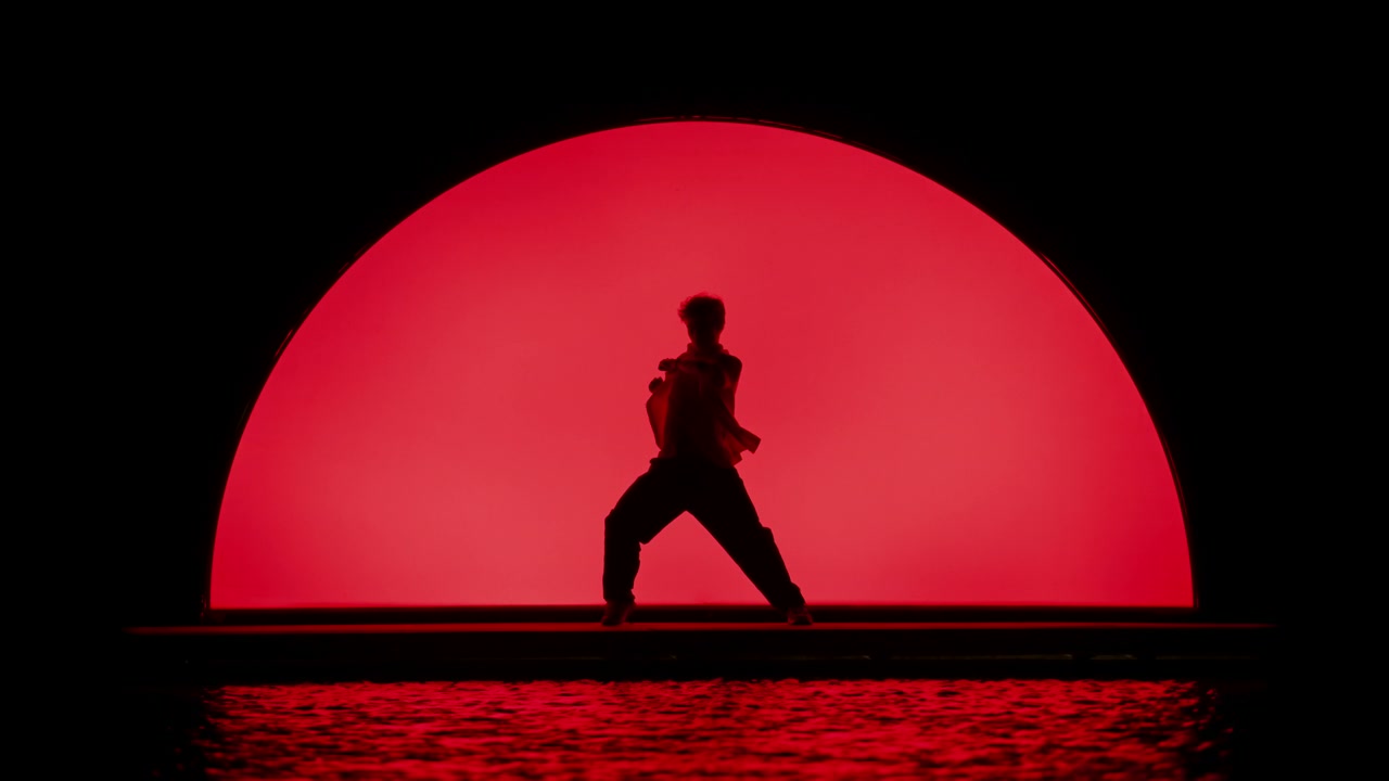 Dancer Silhouette in Red Stage Light