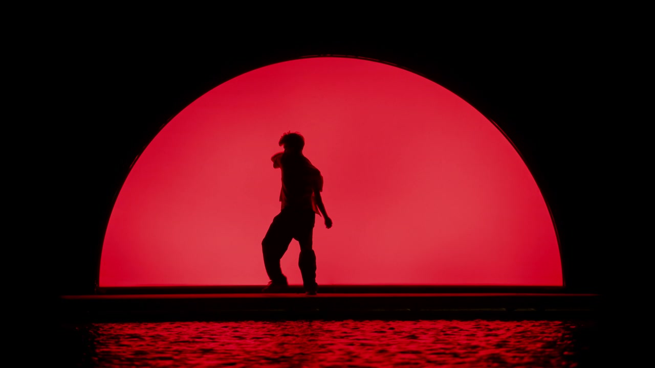 Contemporary Dancer on Wet Stage with Projections • Stock Video on Uppbeat