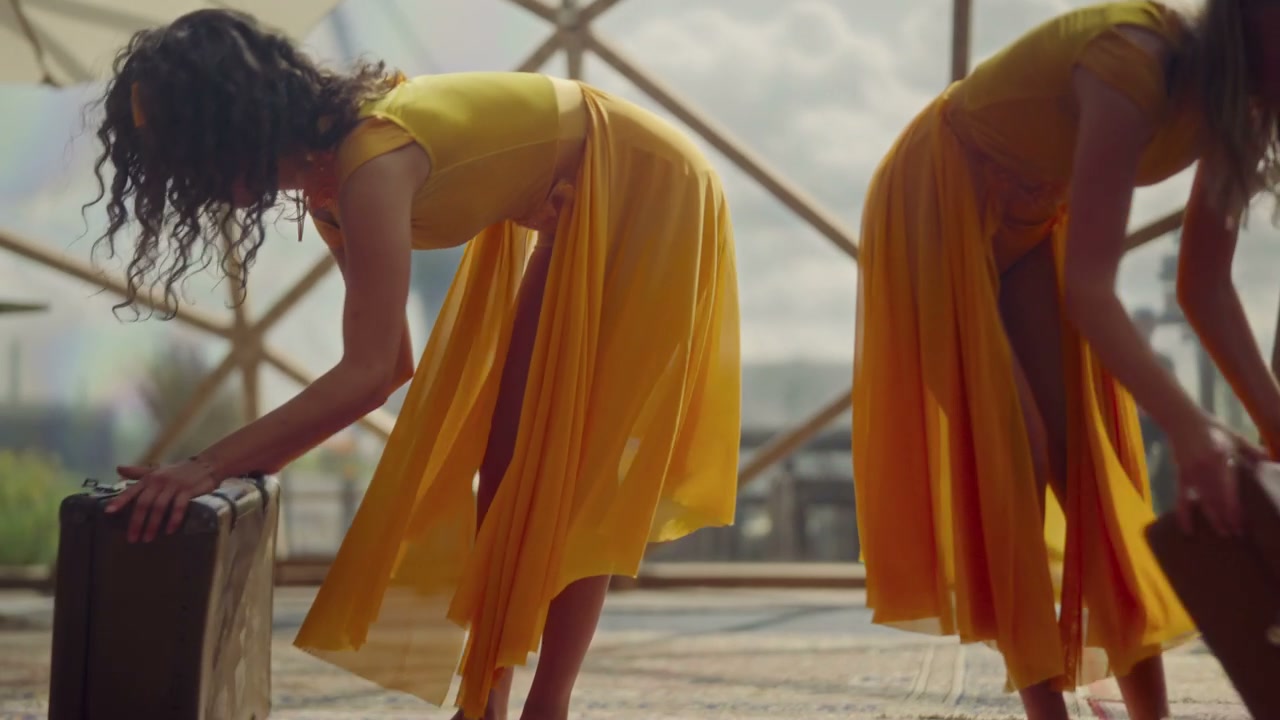 Two Dancers Throwing Clothes From Suitcases