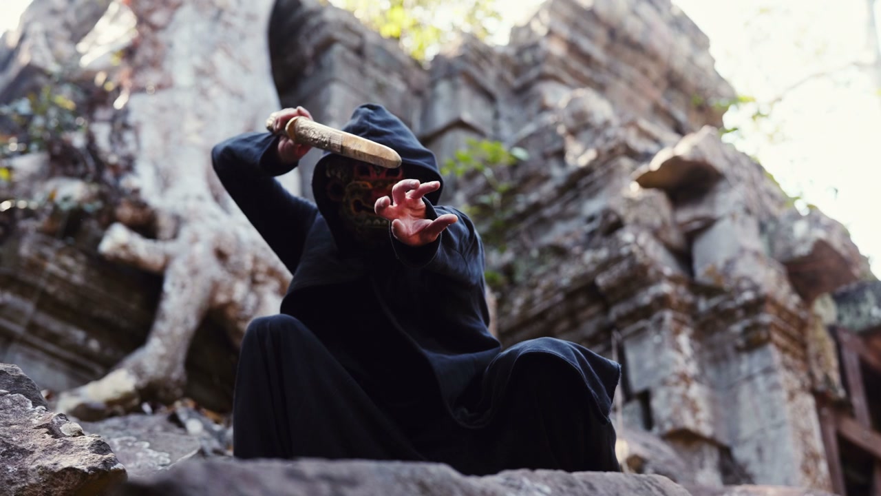 Mysterious Masked Figure Wielding Sword