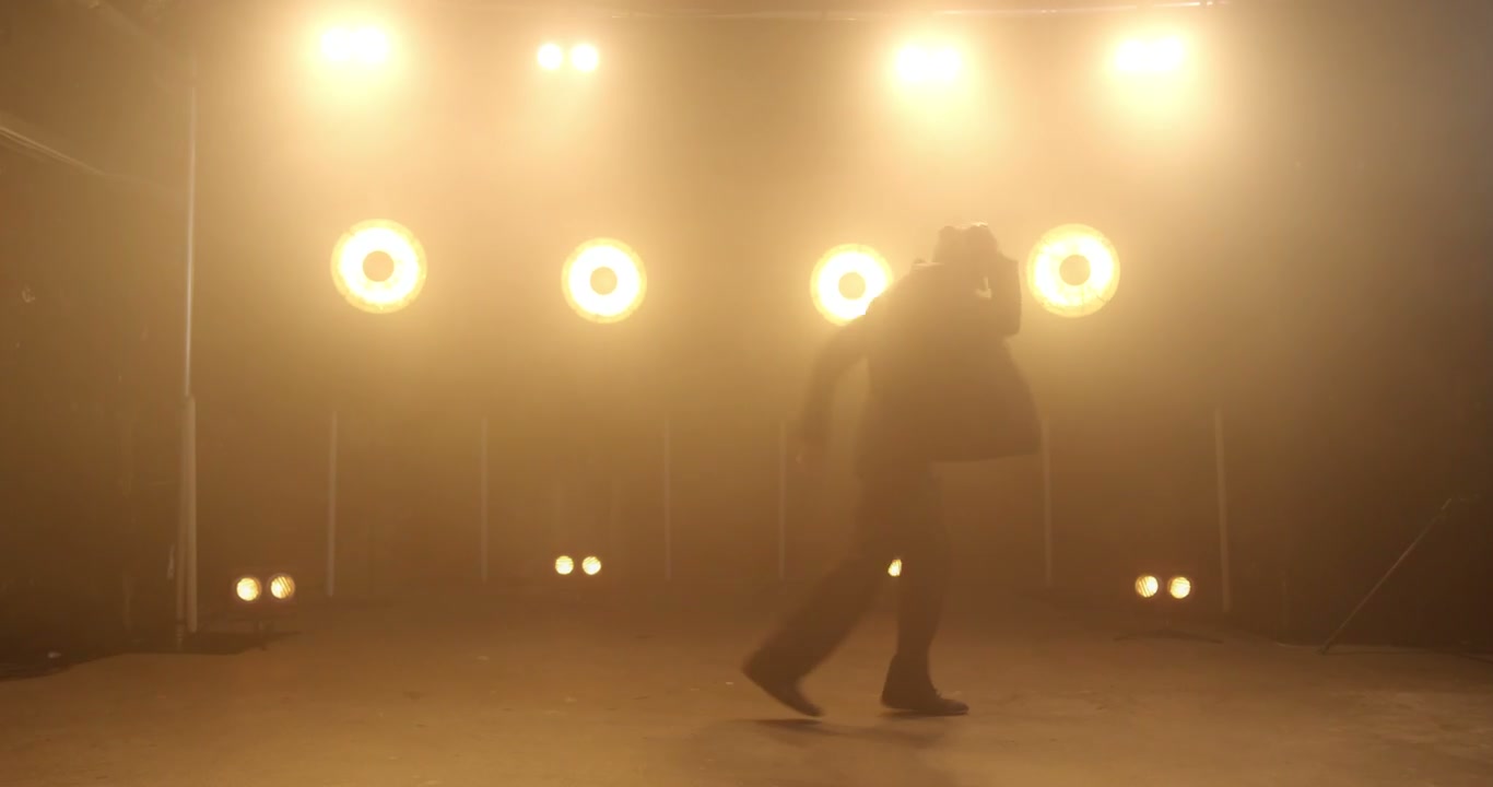 Male Dancer Moonwalking on Stage