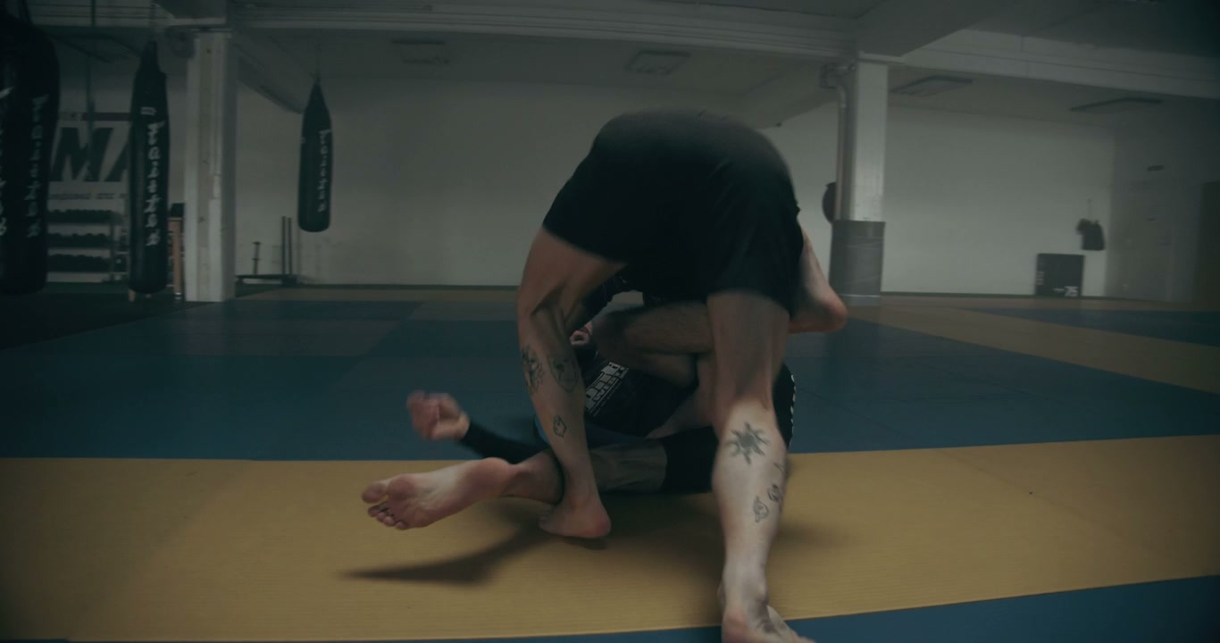 Two Men Grappling in Martial Arts Gym • Stock Video on Uppbeat