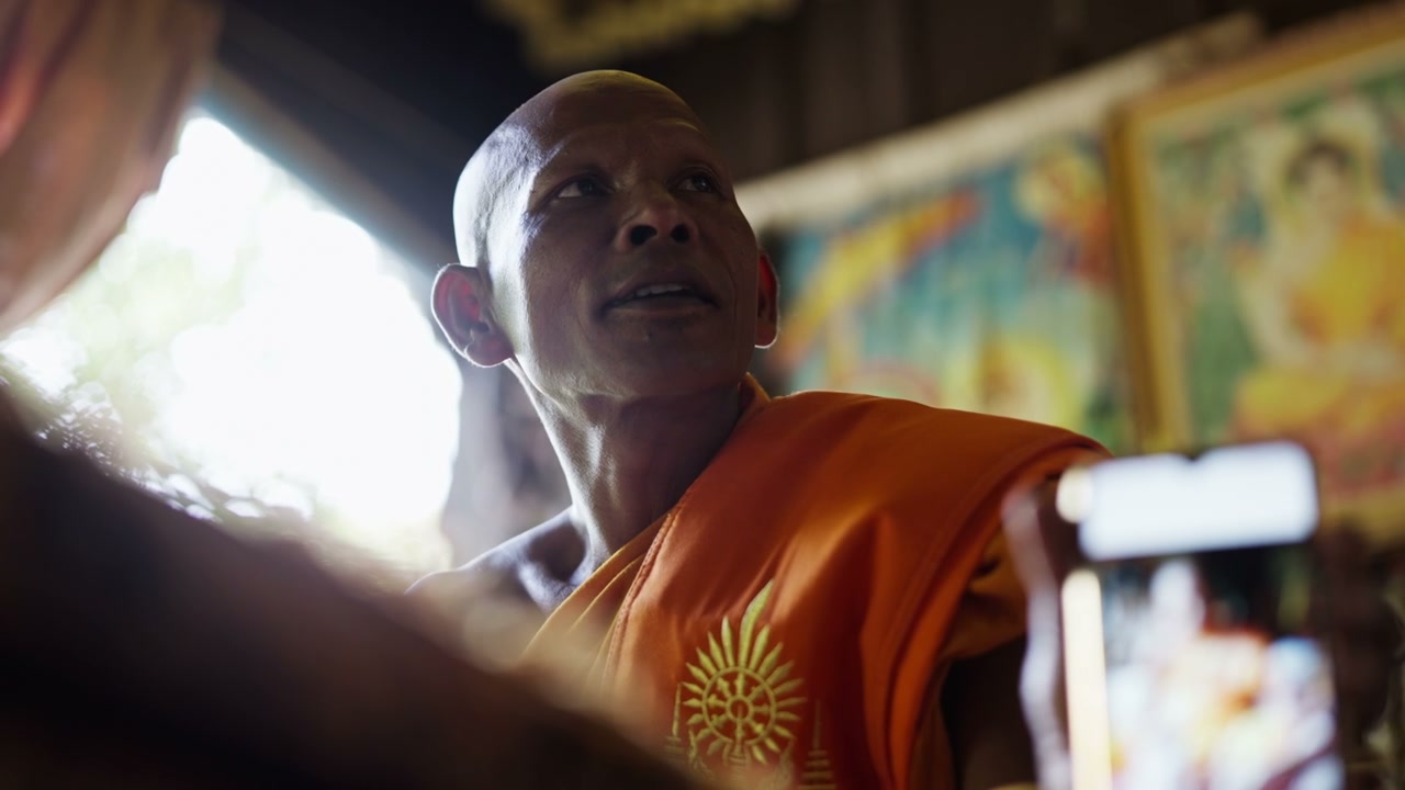Buddhist Monk Being Recorded on Smartphone