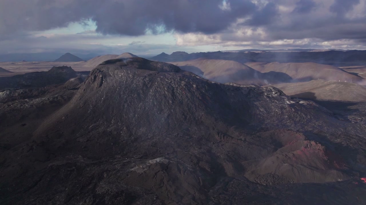 Icelandic Lava Field and Distant Volcano Eruption • Stock Video on Uppbeat