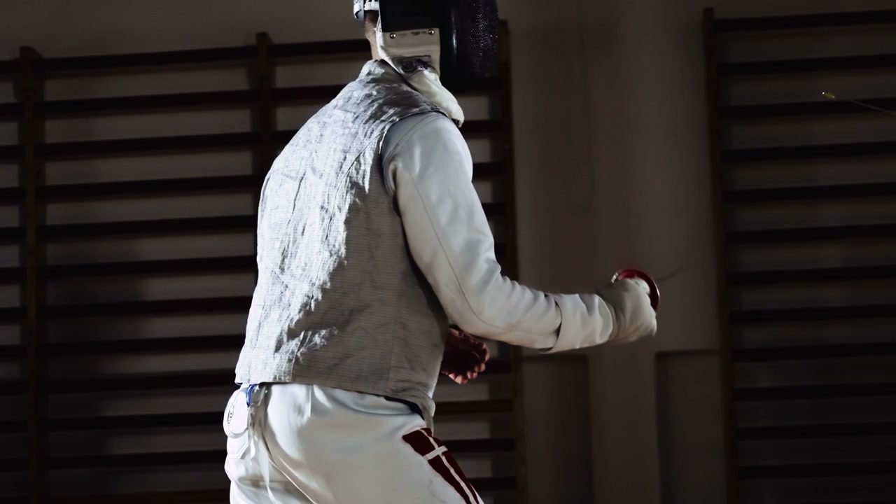 Fencers Practicing Foil Fencing Indoors