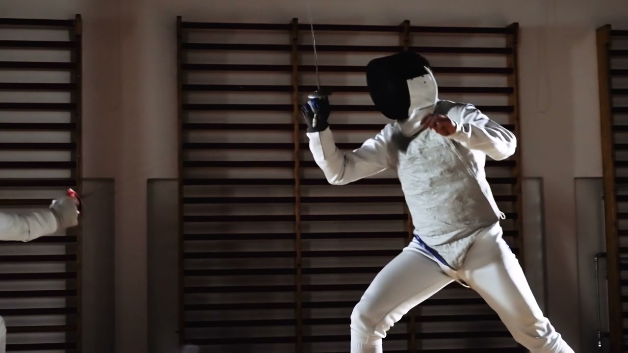 Fencers Duelling with Foils