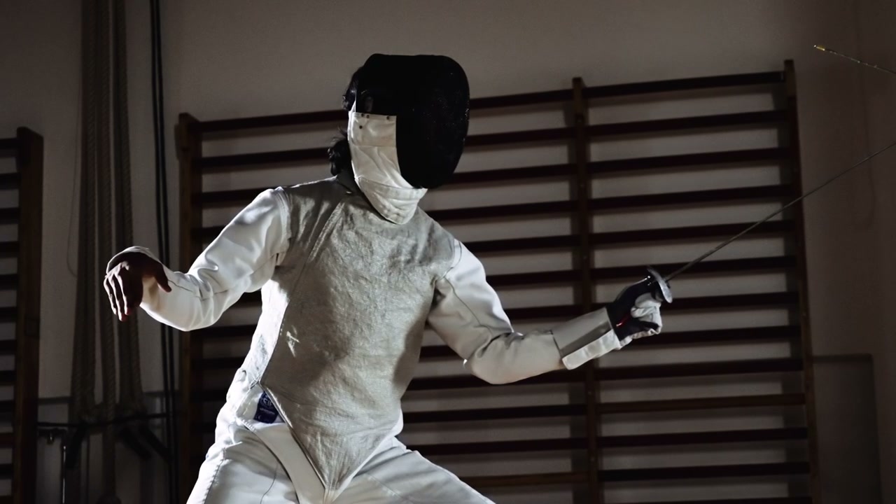 Fencer Engaged in a Foil Duel