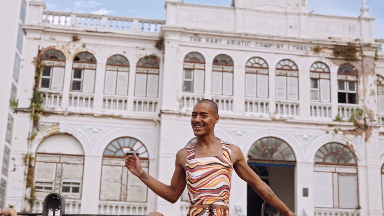 Stylish Friends Laughing Outdoors in Thailand