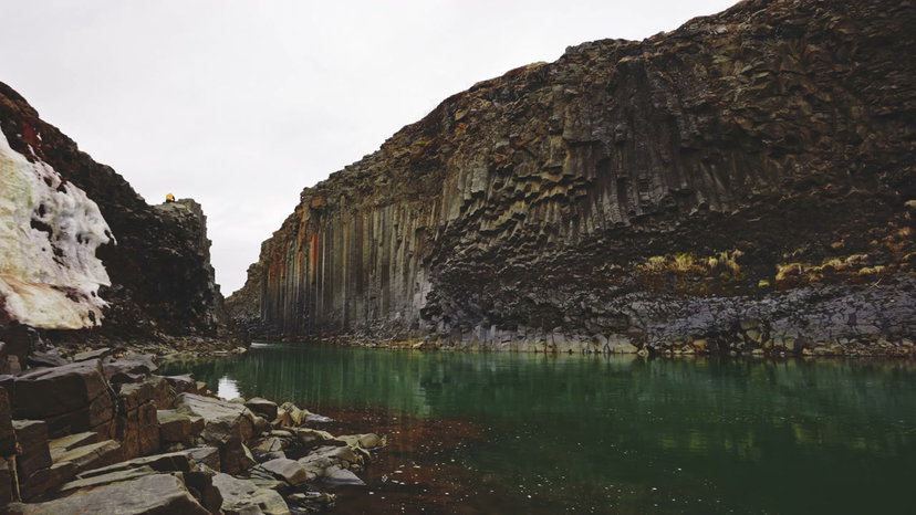 River Flowing Through Basalt Canyon, Iceland • Stock Video on Uppbeat