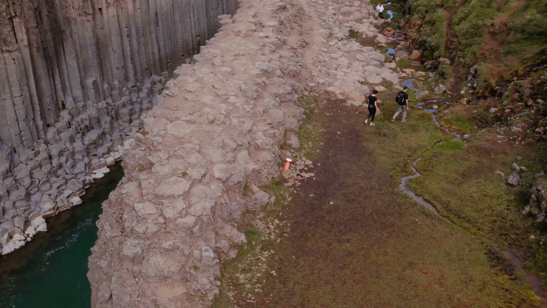 River Flowing Through Basalt Column Canyon • Stock Video on Uppbeat