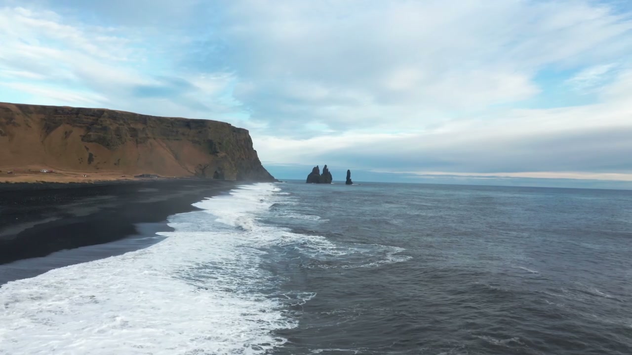 Icelandic Black Sand Beach with Sea Stacks • Stock Video on Uppbeat