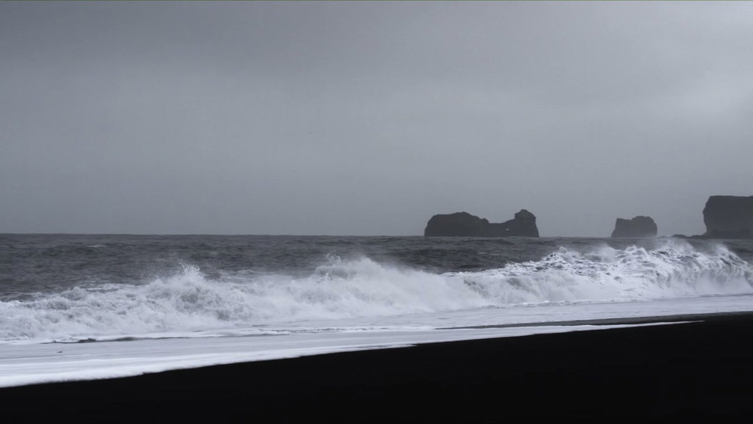 Reynisfjara Black Sand Beach with Sea Stacks • Stock Video on Uppbeat