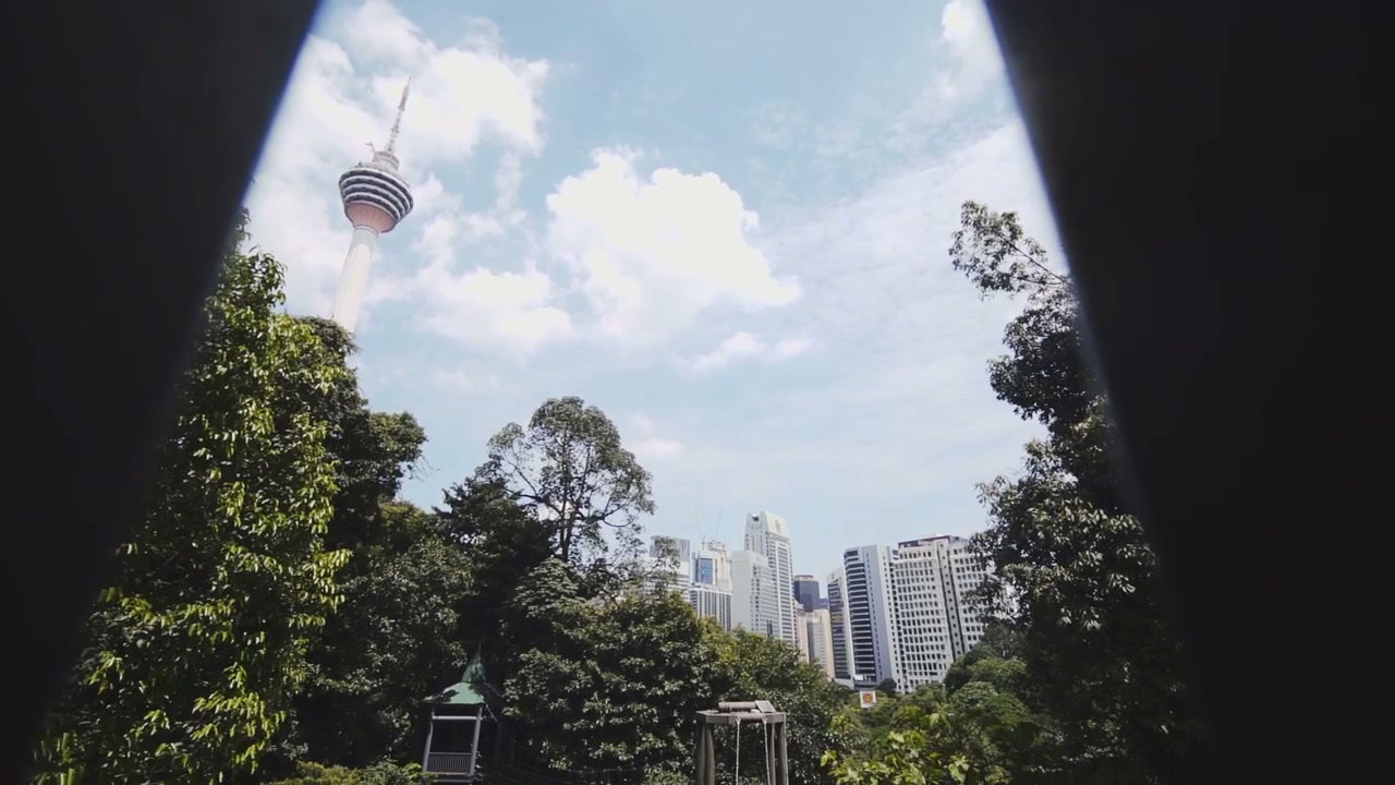 Kuala Lumpur Tower and City Revealed in Park