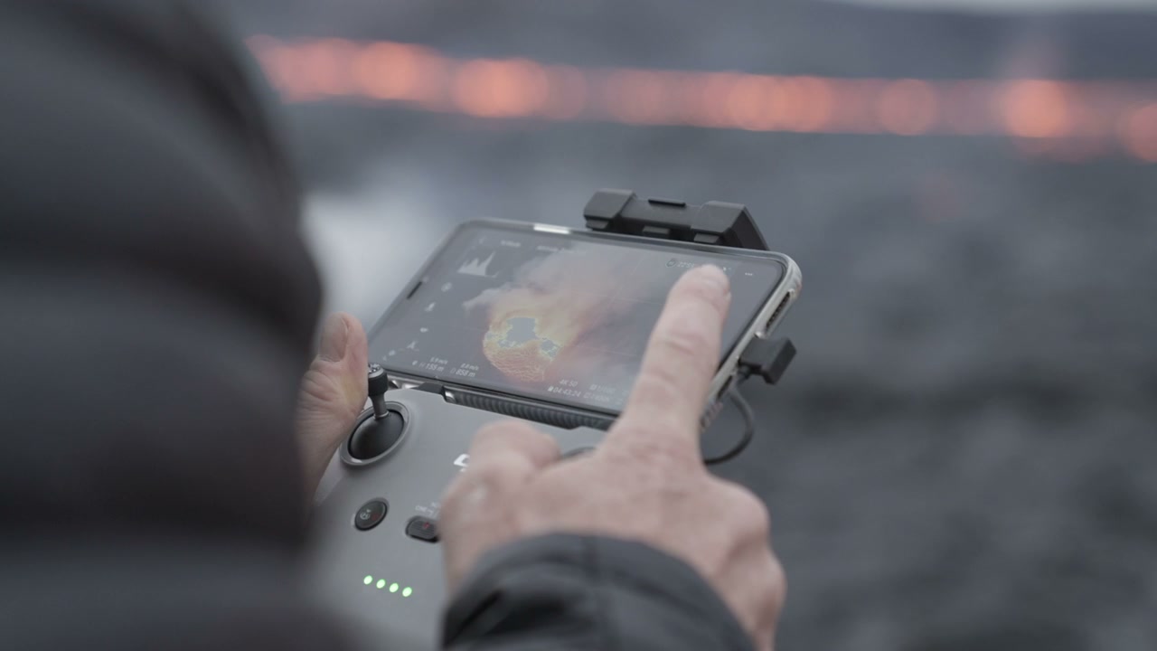 Drone Operator Viewing Volcanic Eruption